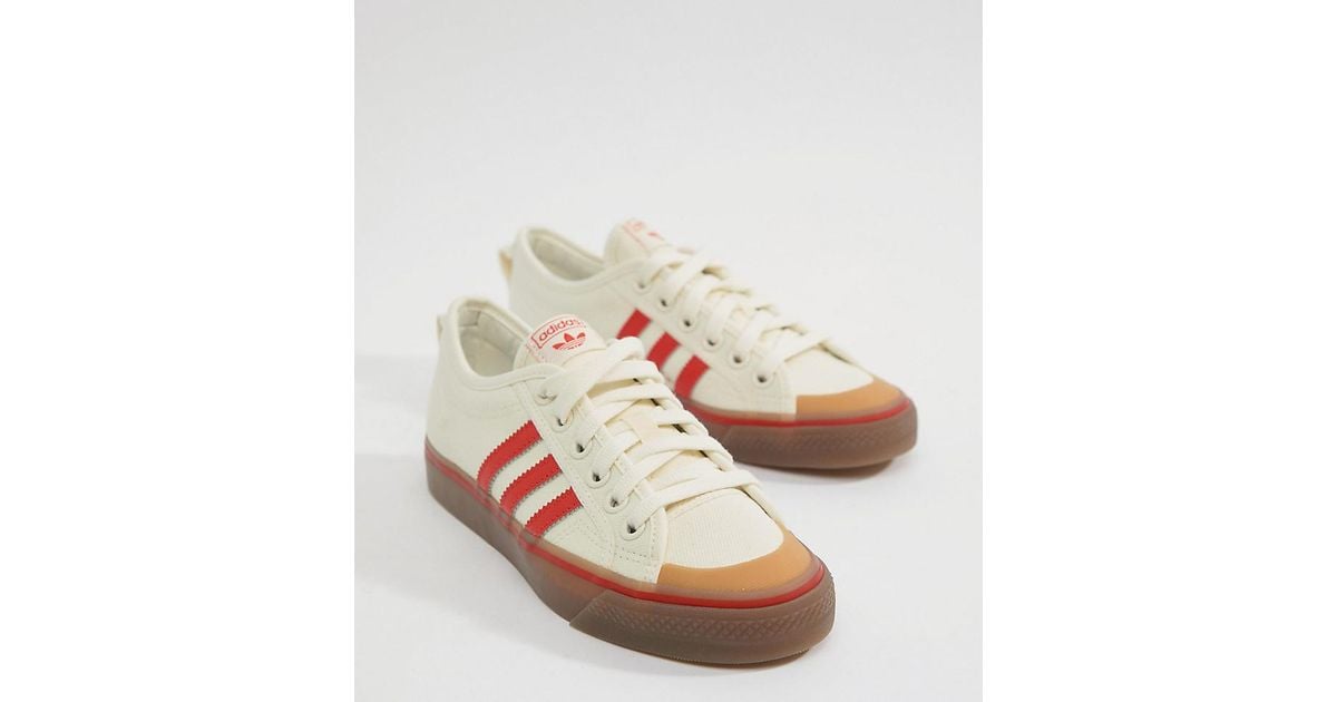 adidas originals nizza canvas sneakers in white and red