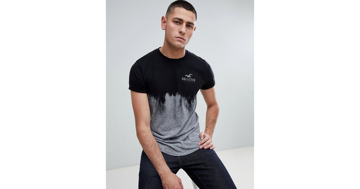 https://cdna.lystit.com/1200/630/tr/photos/asos/9ee33dfb/hollister-black-Ombre-Wash-Front-And-Back-Logo-Print-T-shirt-Curved-Hem-In-Black-To-Gray.jpeg