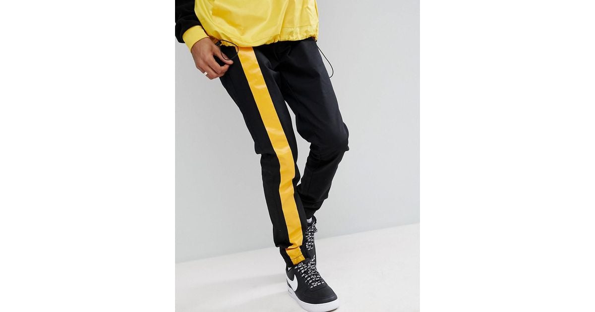 yellow pants black stripe