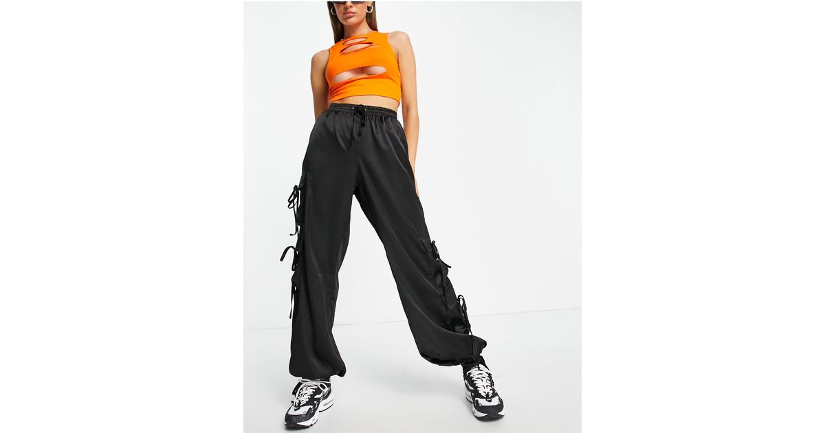 reading Automatically dessert Missguided Satin Cargo Trousers With Tie Cuff Detail in Black | Lyst