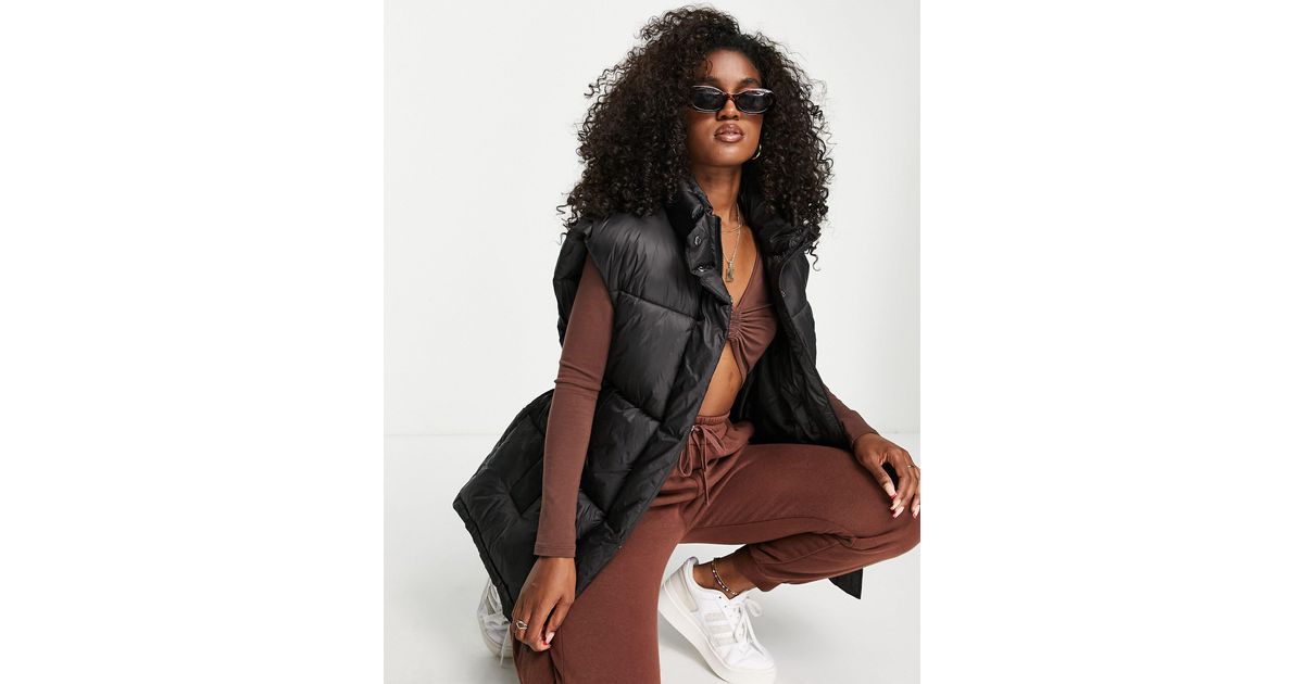 ASOS DESIGN cord puffer vest in brown - ShopStyle