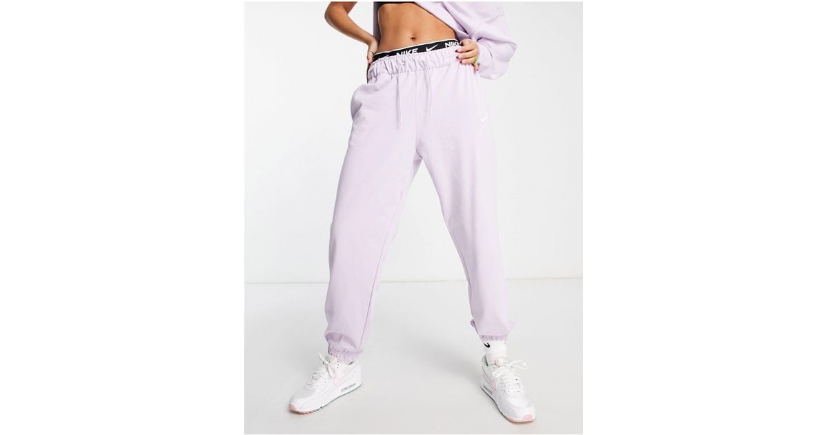 Nike Mini Swoosh Oversized High Rise Trackies in Lilac (Purple) Lyst