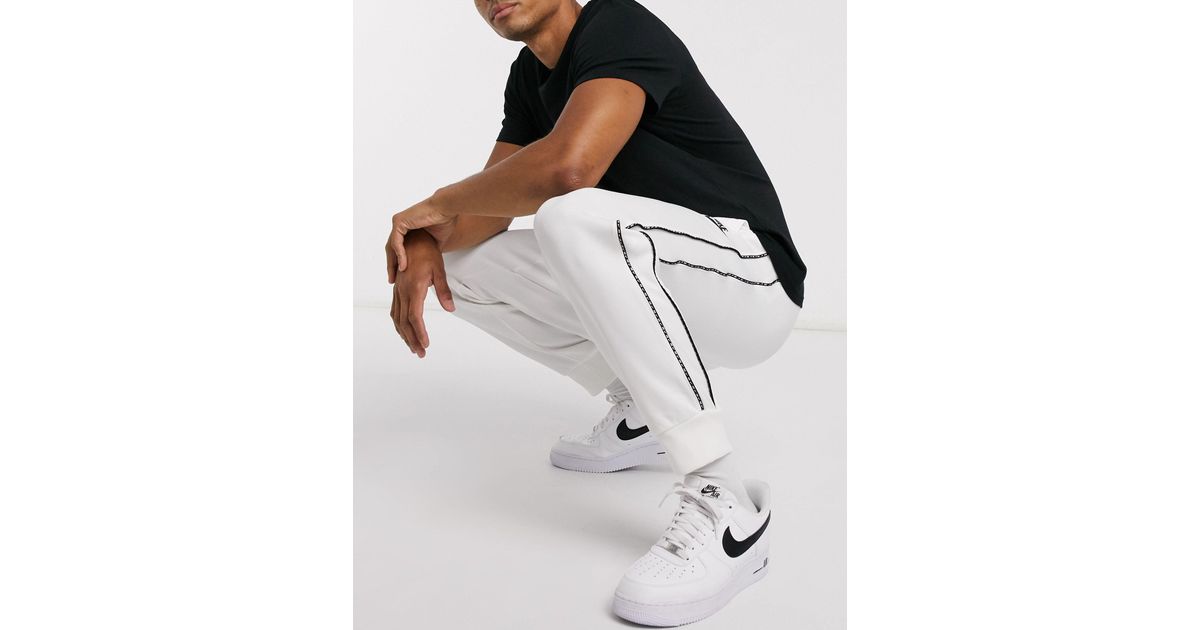 Nike – Repeat Pack – Polyknit-Jogginghose mit engen Bündchen und Logoband  in Weiß für Herren | Lyst DE