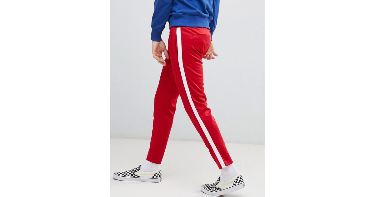 Pantaloni casual rossi con riga laterale biancaBershka in Denim da Uomo  colore Rosso | Lyst