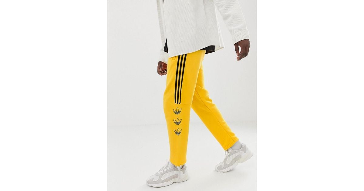adidas track pants yellow stripe