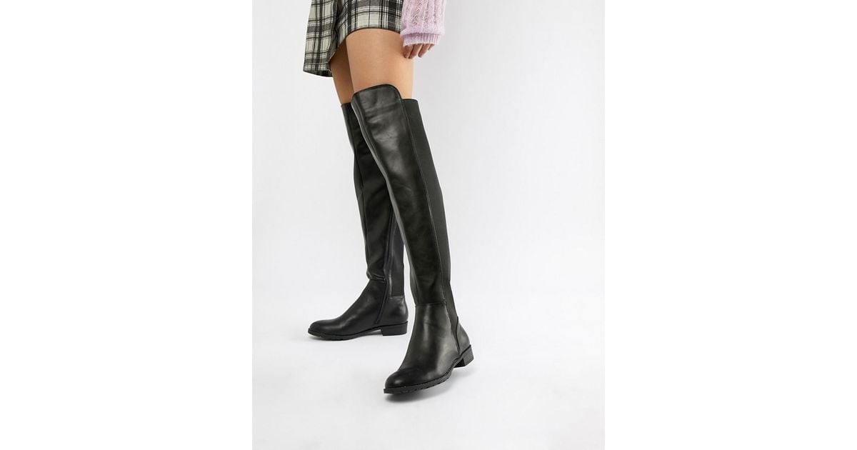 London Rebel Elastische, flache Overknee-Stiefel in Schwarz | Lyst DE