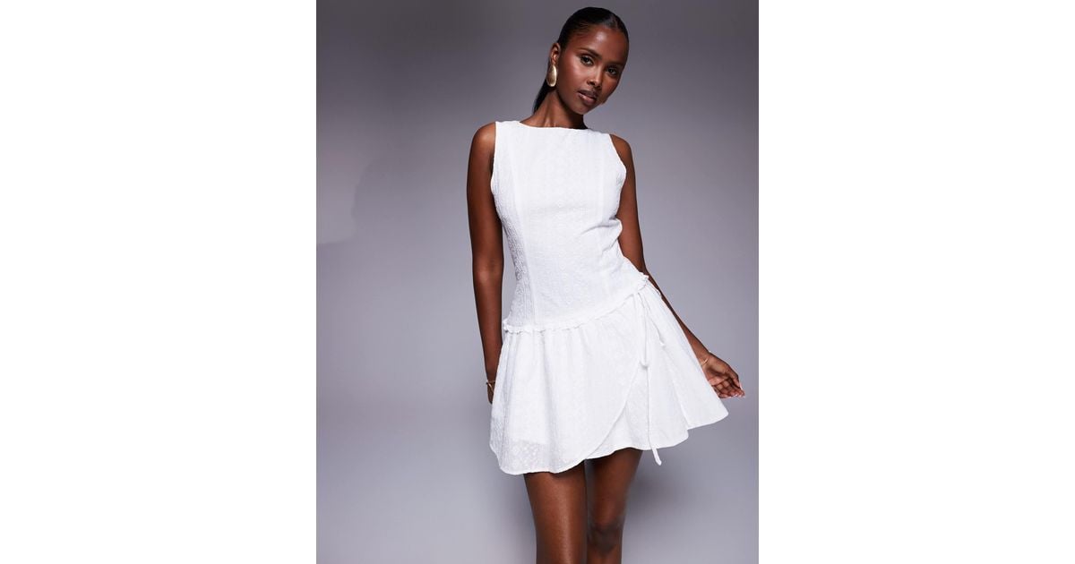 Princess Polly Cosie Broderie Sleeveless Tie Side Ruffle Hem Mini Dress in  White | Lyst