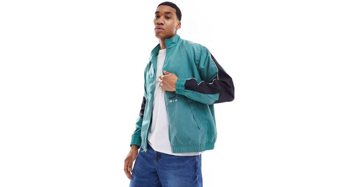 nike swoosh woven jacket teal