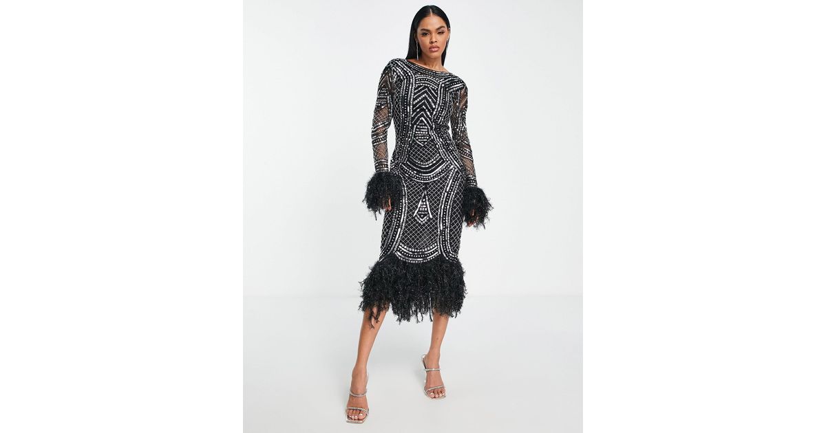 Robe à sequins mi-longue avec manches longues et bordures en