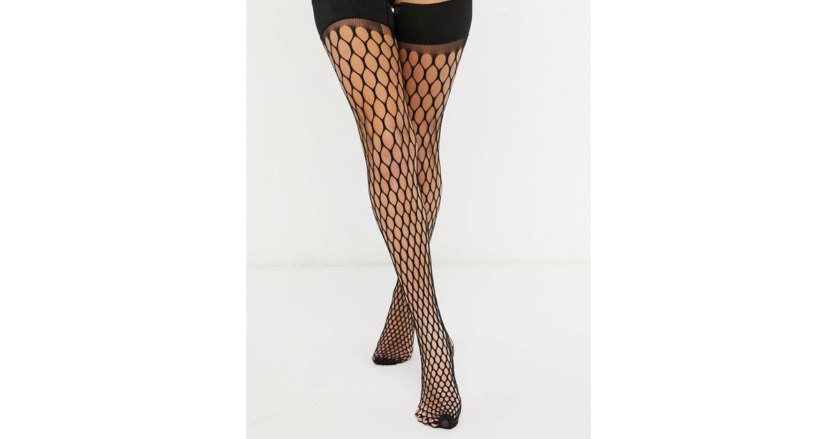 large scale fishnet tights