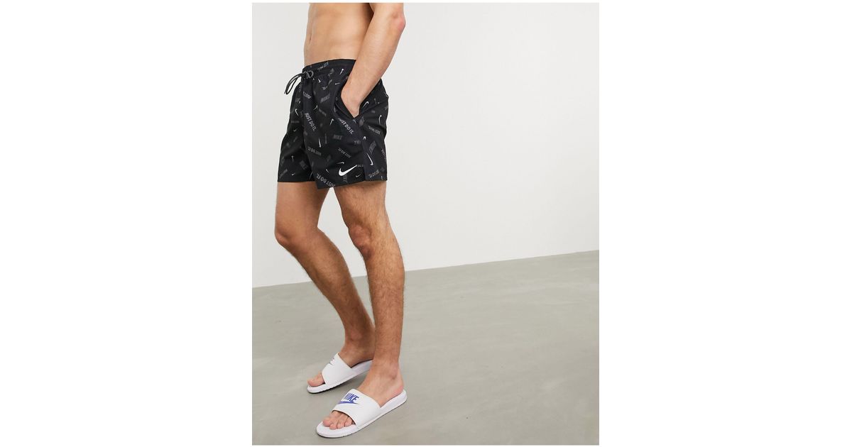 nike swimming 5inch volley shorts with all over swoosh print in black
