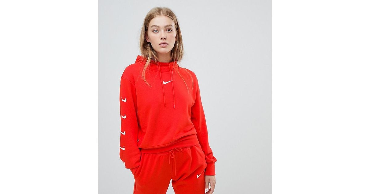 red nike hoodie with swoosh all over