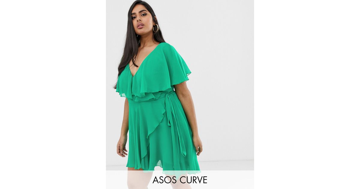 cape back dipped hem dress