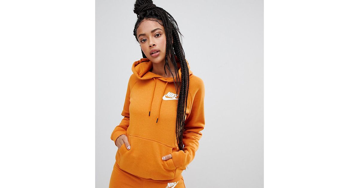 nike rally burnt orange logo sweatpants