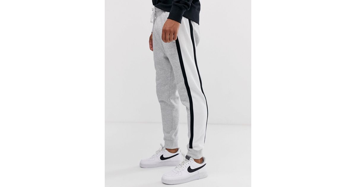 Grey nike joggers top with black stripe