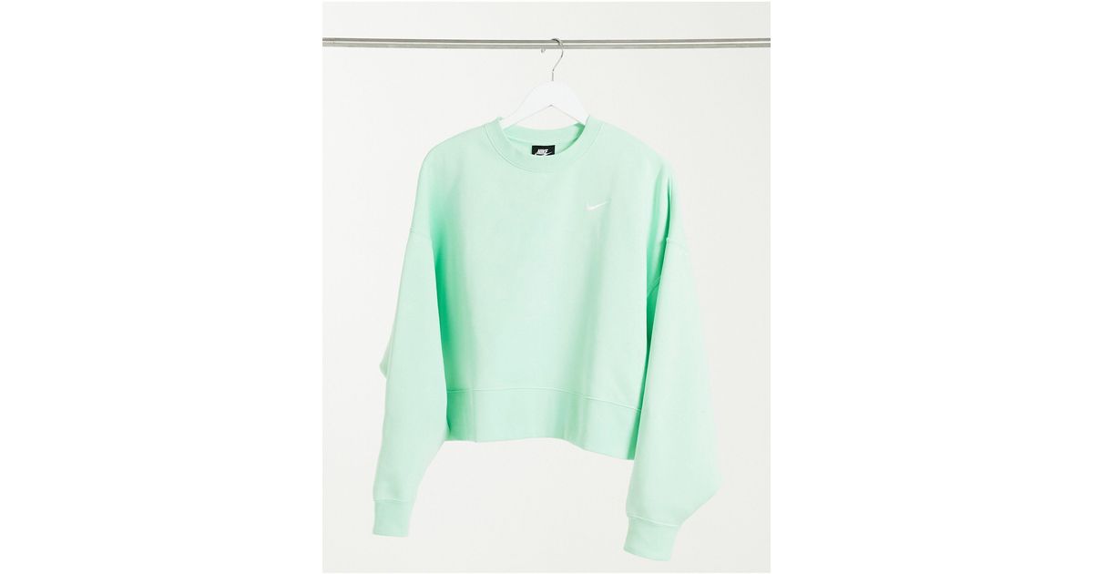 Nike mini swoosh oversized boxy sweatshirt in green Clearance