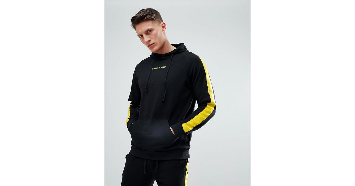 black hoodie with yellow stripe
