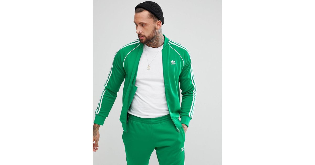 adidas originals adicolor three stripe track jacket in green