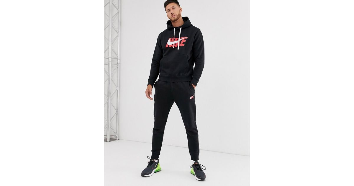 nike swoosh logo tracksuit
