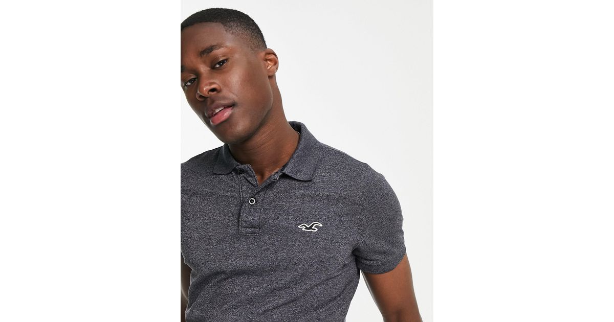 Polo ajustado con logo distintivo Hollister de hombre de color Gris | Lyst