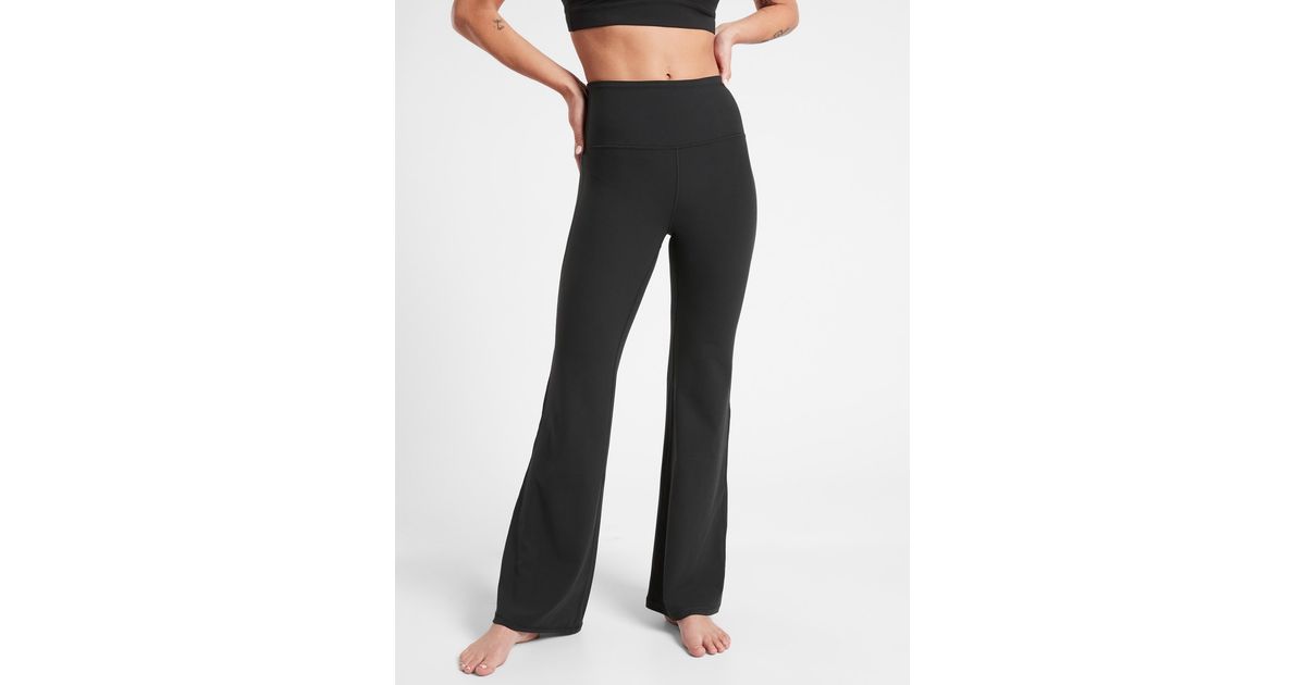 Athleta Elation Flare Pant in Black | Lyst