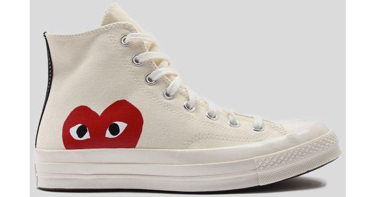 white with red heart converse