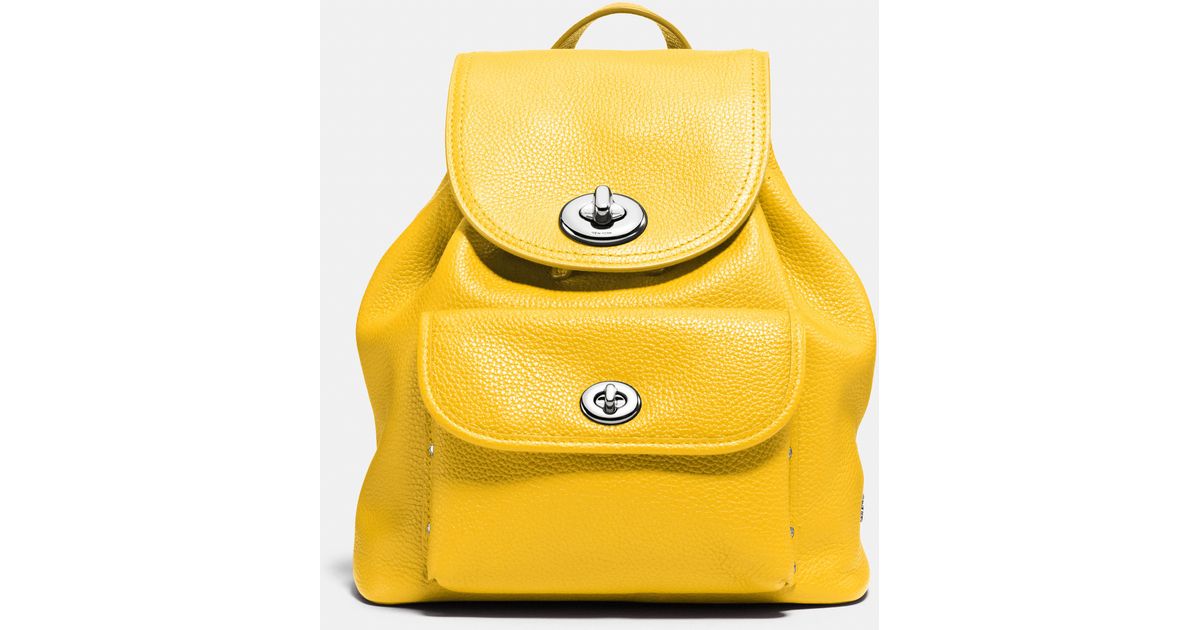 yellow coach backpack