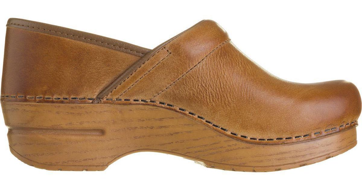 dansko clogs honey distressed