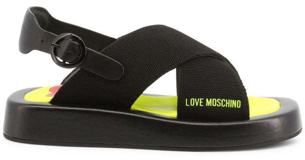 Femme Chaussures plates Chaussures plates Love Moschino Flip flops Cuir Love Moschino en coloris Noir 