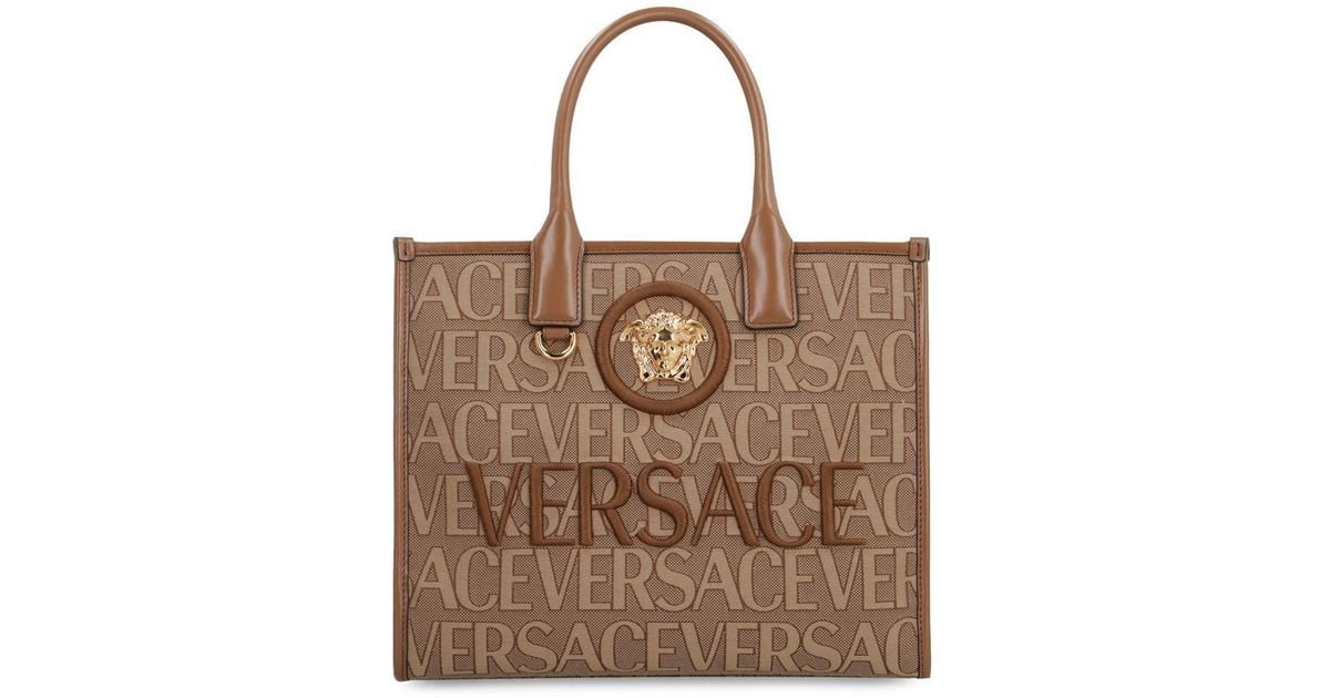Versace All Over Logo Canvas Tote in Brown | Lyst
