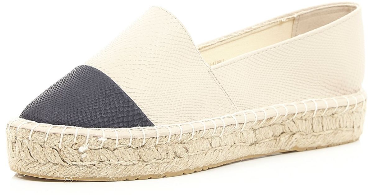 cream and black espadrilles