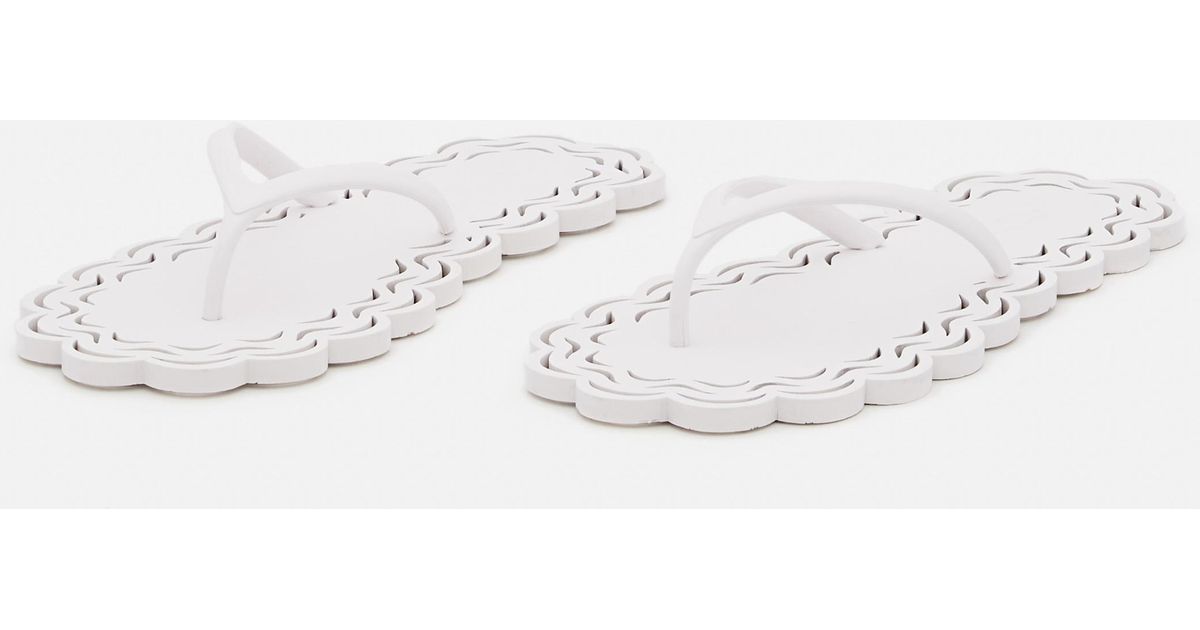 Carlotha Ray Laser-cut Recycled Rubber Flip Flops in White | Lyst UK