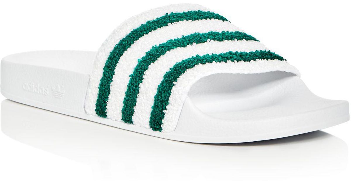 white adidas adilette slides