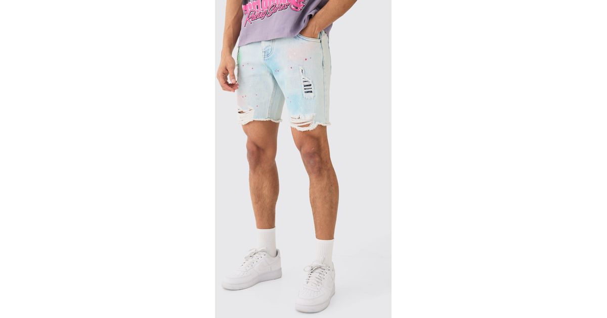 BoohooMAN Relaxed Fit Ripped Paint Splatter Denim Jorts In Light Blue