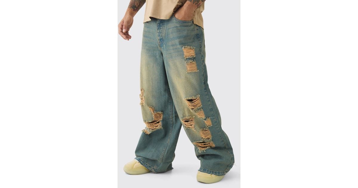 BoohooMAN Extreme Baggy Rigid All Over Ripped Jeans in Blue for