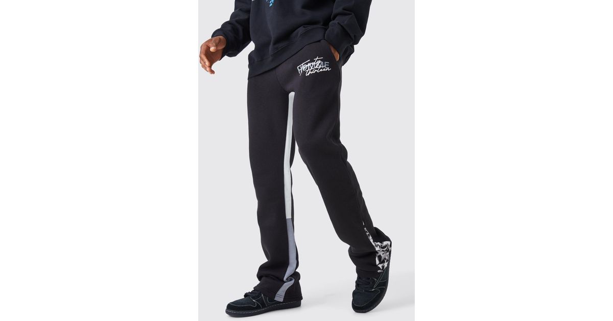 BoohooMAN Slim Stacked Flare Star Print Gusset Jogger in Black for