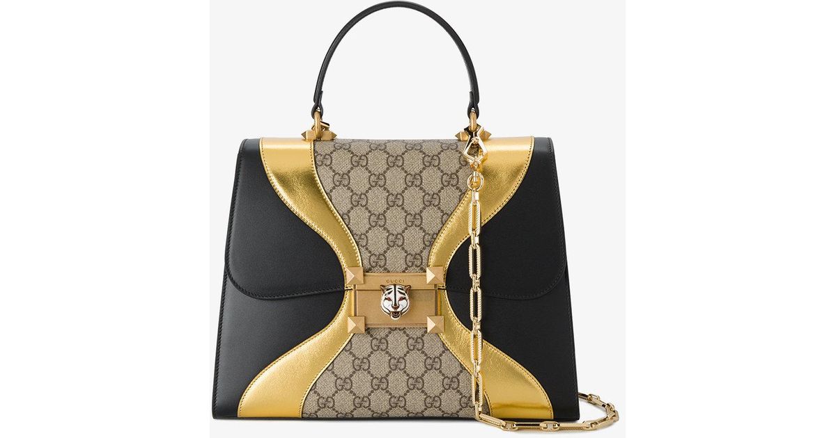 black and gold gucci purse