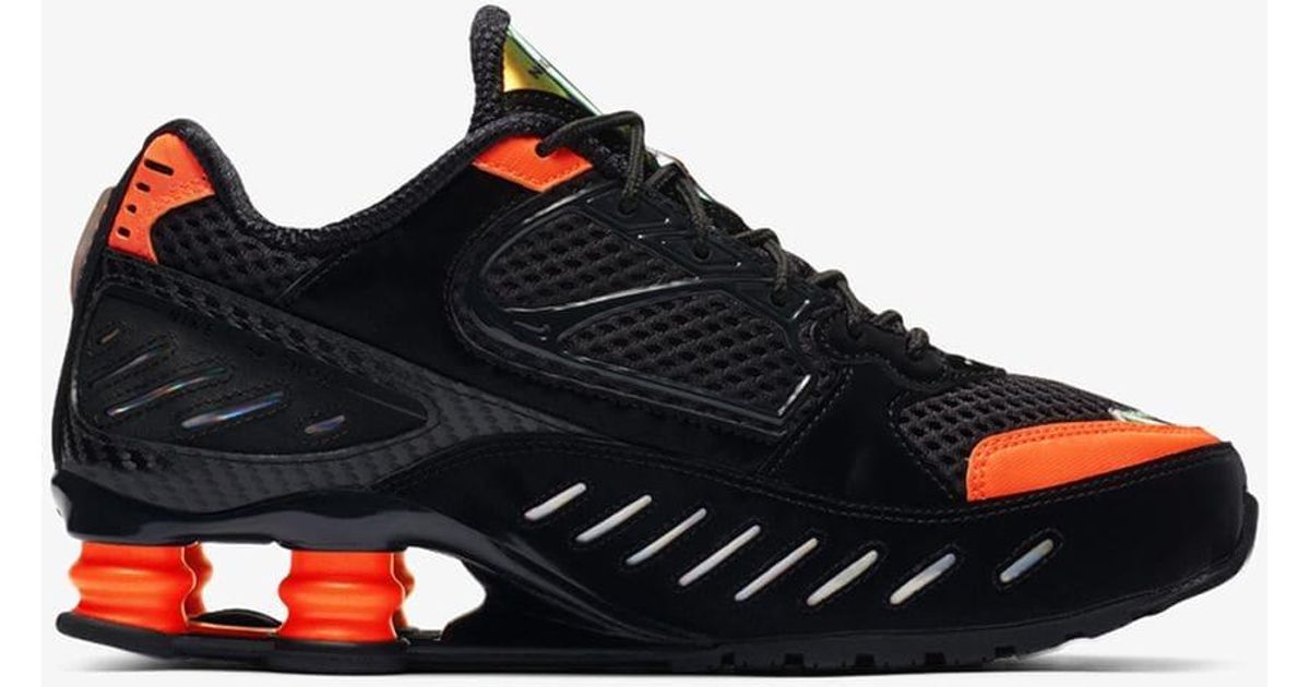 black and orange nike shox