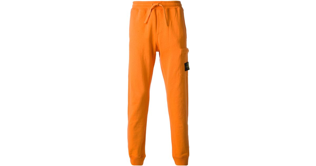 orange track pants