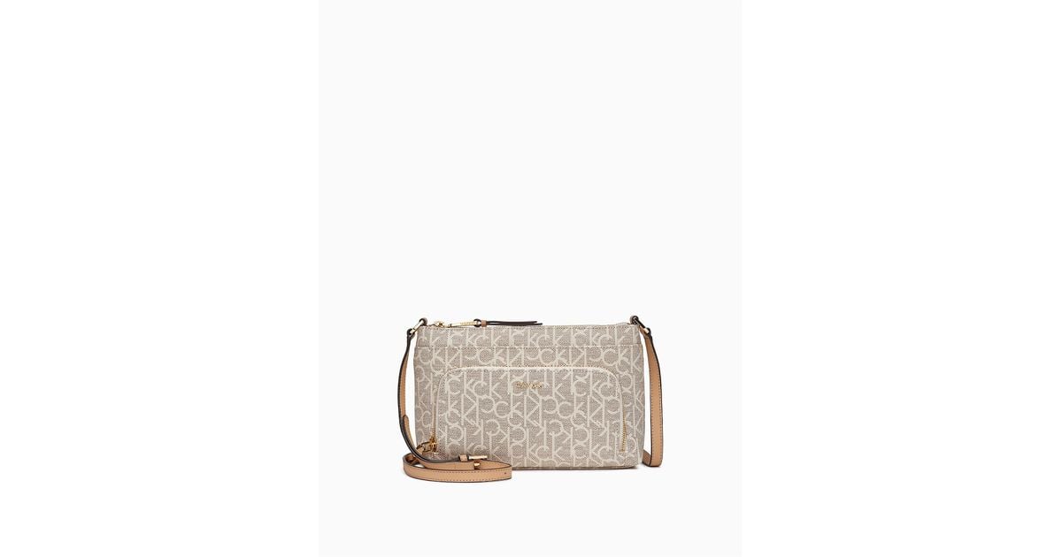 Calvin Klein Monogram Zip Crossbody Bag in Natural | Lyst