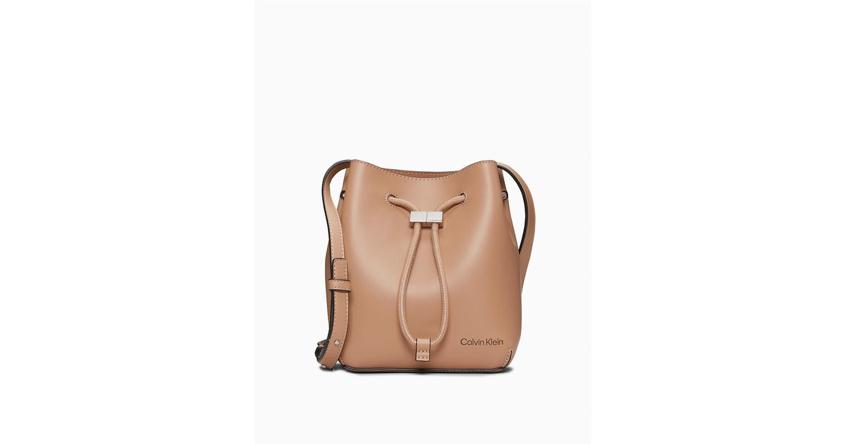 Calvin Klein Smooth Faux Leather Bucket Bag in Brown | Lyst