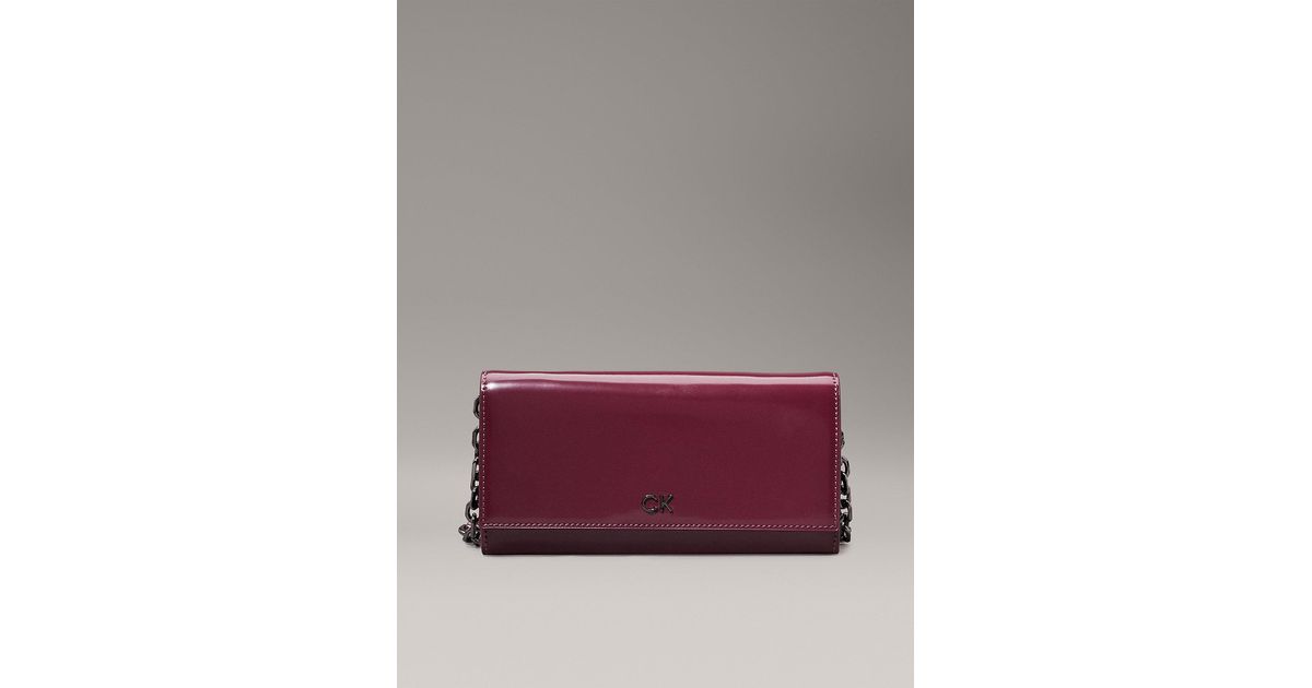 Calvin Klein Shiny Crossbody Wallet Bag in Purple Lyst UK