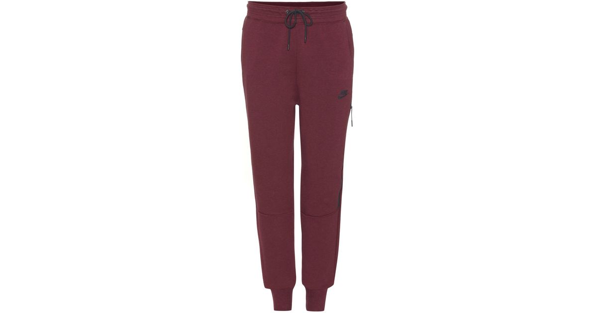 purple nike tech pants