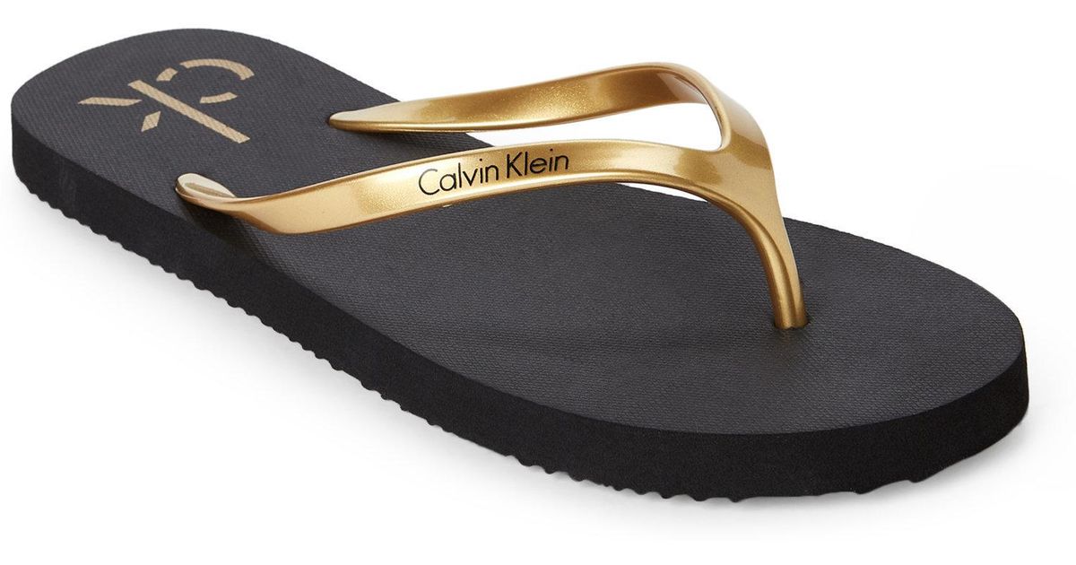 black & gold flip flops