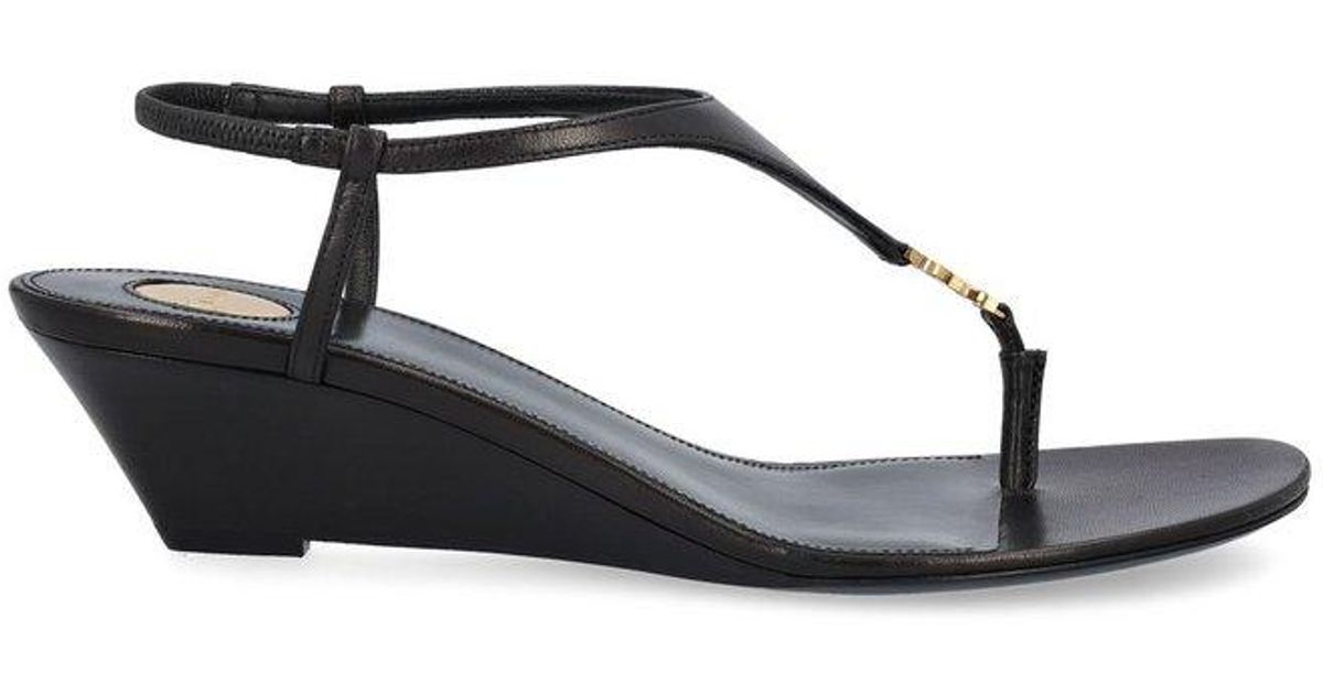 サンダル・ミュール Saint Laurent Black leather Cassandre wedges Cassandre 40 leather wedges in black - Saint Laurent | Mytheresa