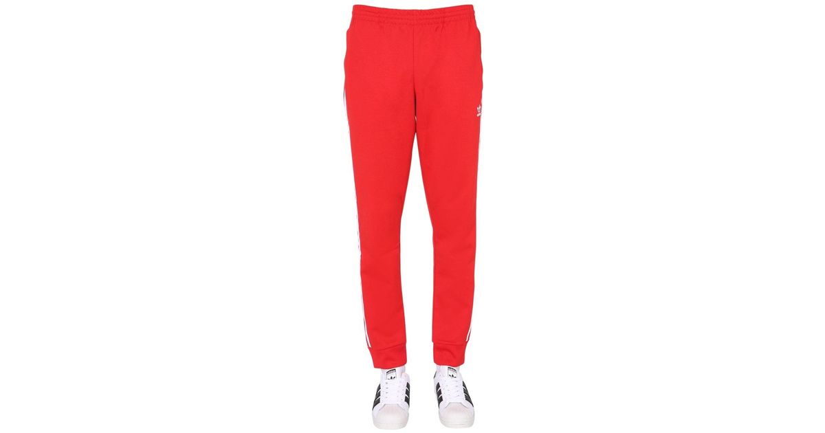 adicolor classics primeblue sst track pants red
