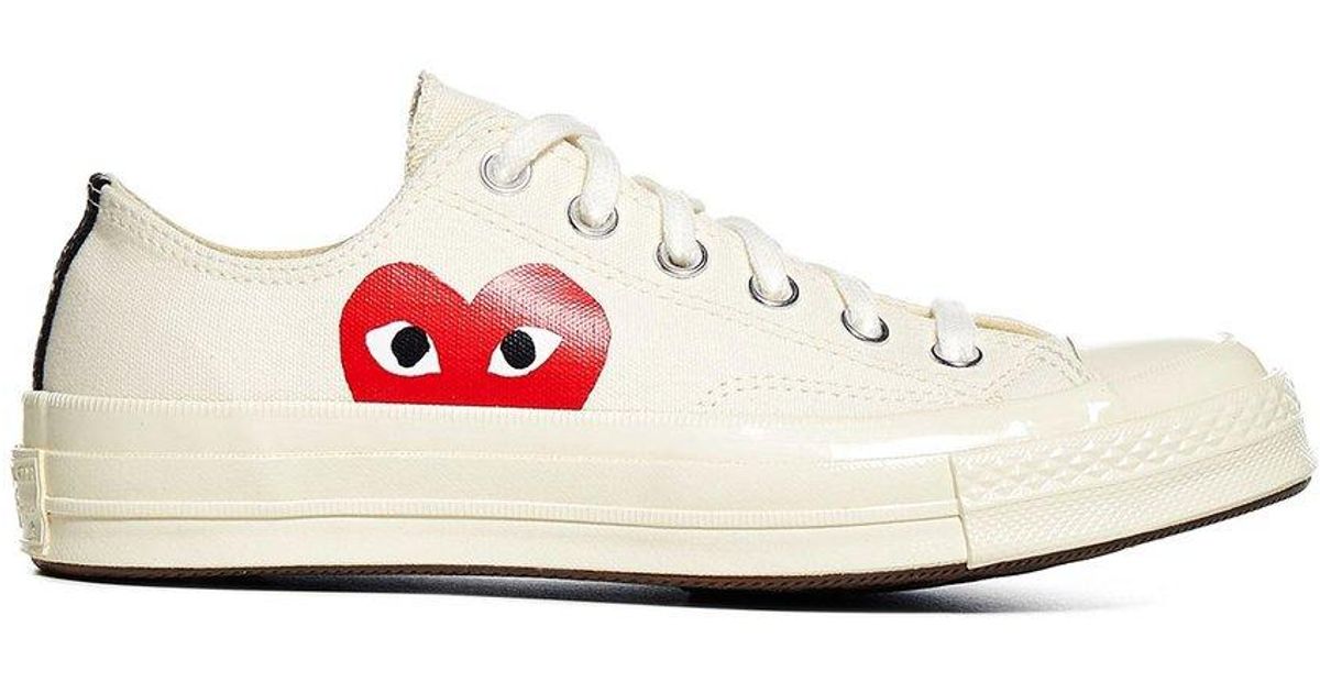 beige converse with heart