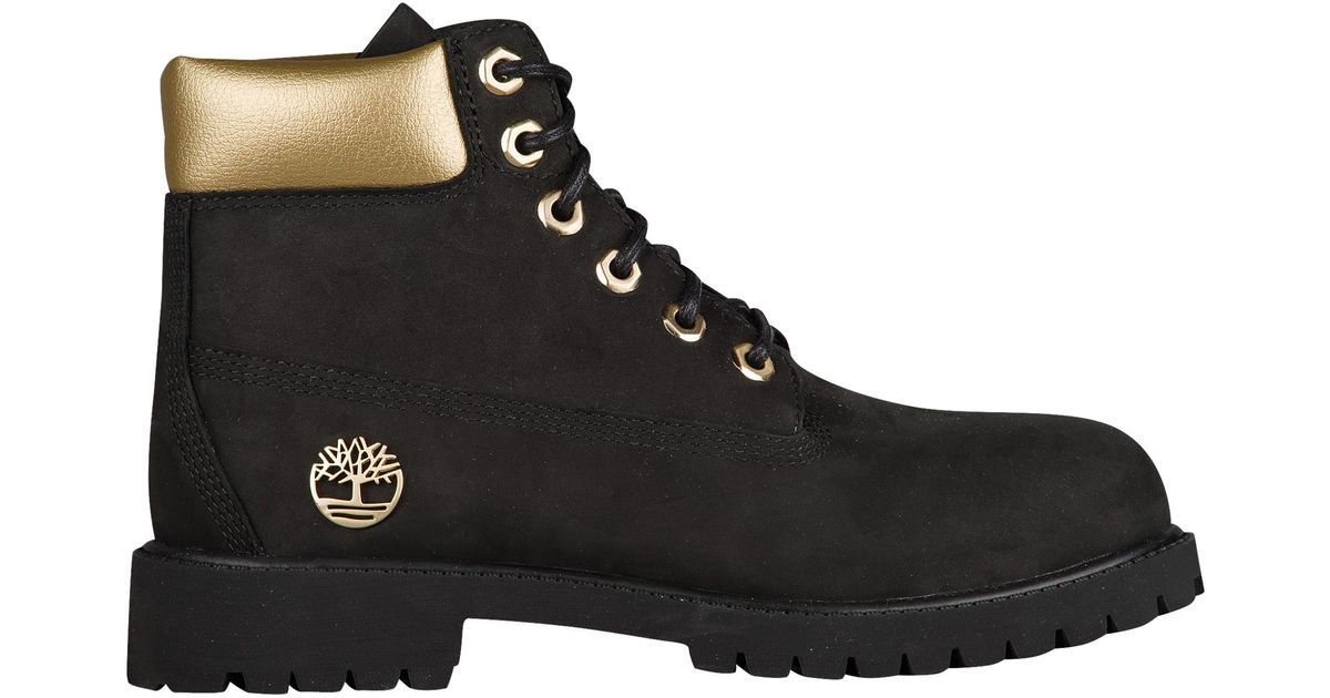 black and gold timbs