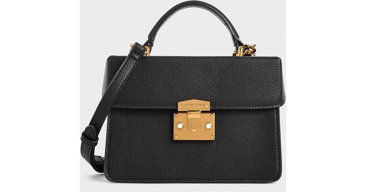 classic push lock top handle bag