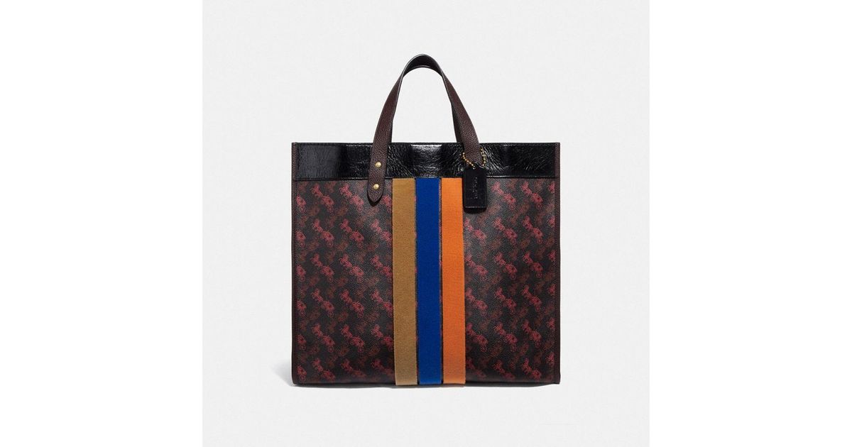 coach field tote 40 with horse and carriage print and varsity stripe
